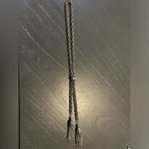 Silver slide necklace. Has a slider to designate how you will be styling it.